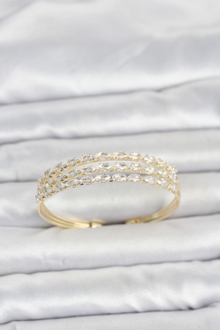 Pirinç Gold Renk Arpa Kesim Zirkon Taşlı Sıralı Model Kadın Bileklik