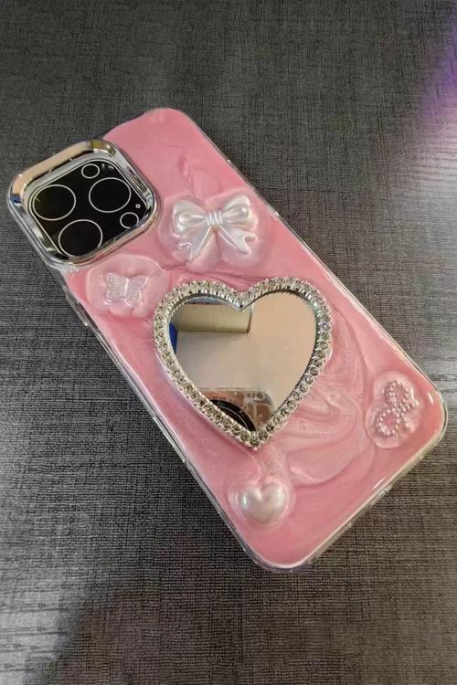 Pembe Renk Kalp Ve Kurdele Figürlü Aynalı 15 Pro Max Telefon Kılıfı