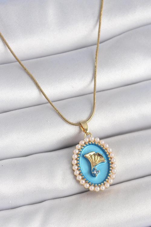 316L Çelik Gold Renk Zincir Mavi Mineli İncili Zirkon Taşlı Çiçek İşlemeli Portre Model Kadın Kolye