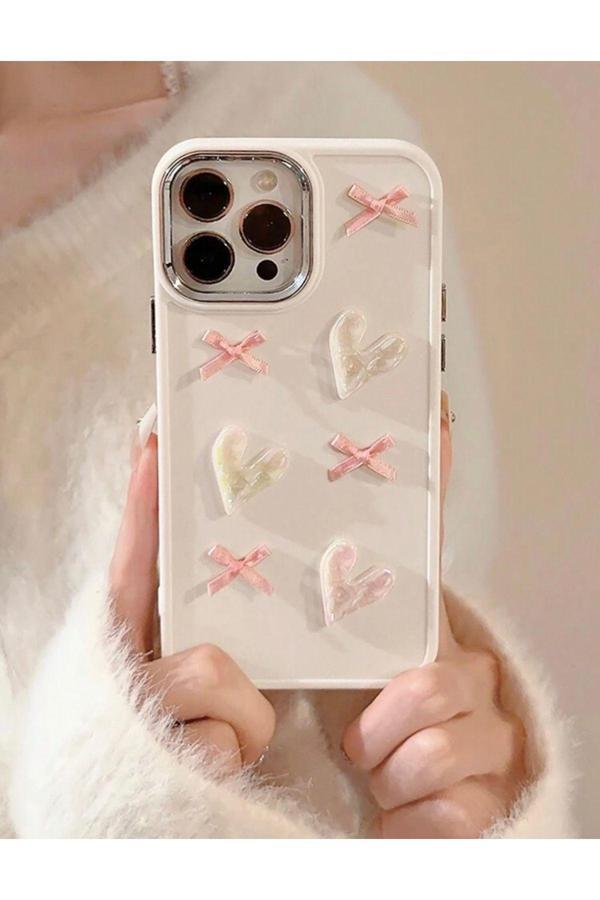 Miraz Tasarim Iphone 16 Pro 3D Kalp Ve Fiyonk Dekorlu Ekru Renk Kılıf - Image 1