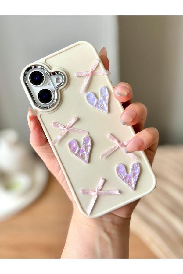 Miraz Tasarim Iphone 16 3D Kalp Ve Fiyonk Dekorlu Ekru Renk Kılıf - Image 1