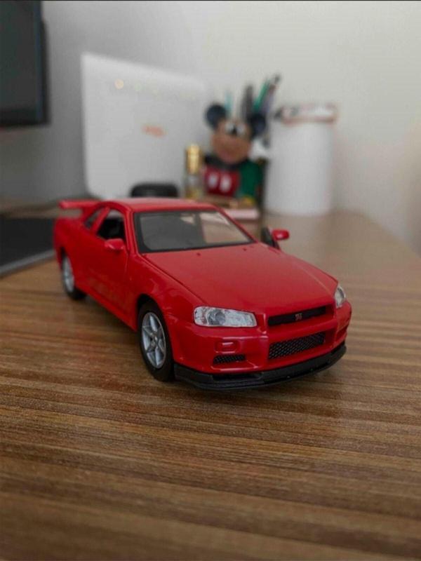 Toyfest Kırmızı Nissan Skyline Gtr R34 Kapıları Açılabilen Çek Bırak Araba Welly 1:32 - 11.5 Cm - Image 1