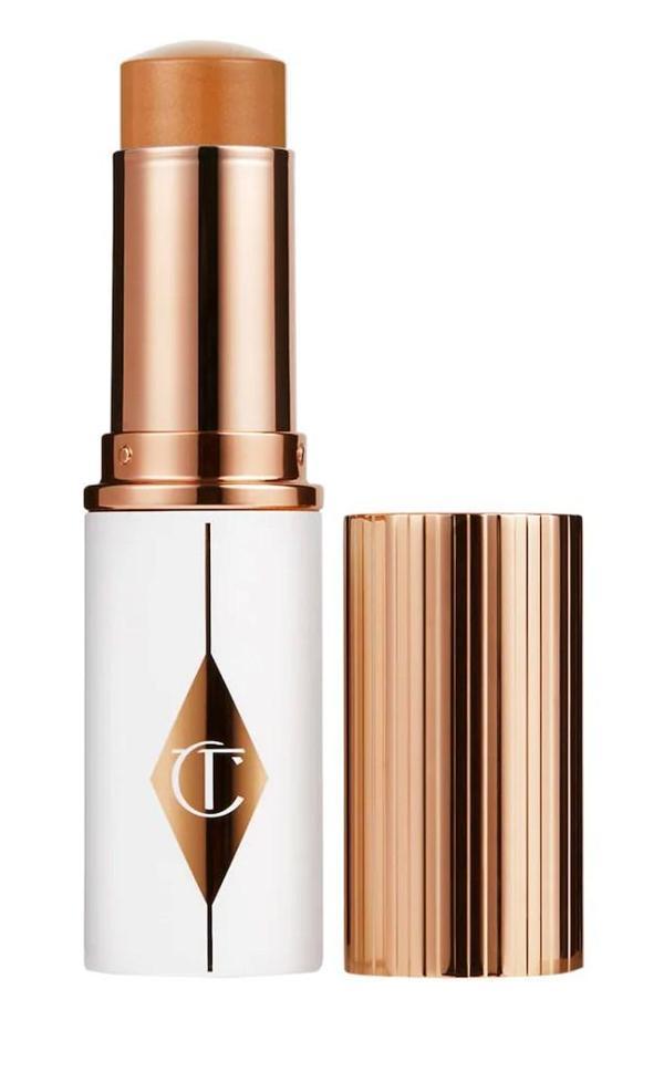 Charlotte Tilbury Unreal Skin Sheer Glow Tint 10 Tan- Nemlendirici Stick fondöten 8 ml - Image 1