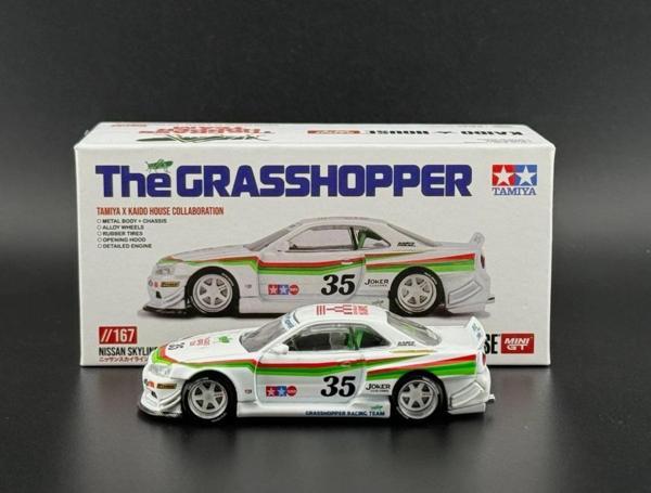 Kaido House Mini GT 1/64 Nissan Skyline GT-R (R34) TAMIYA The GRASSHOPPER V1  167 - Image 1
