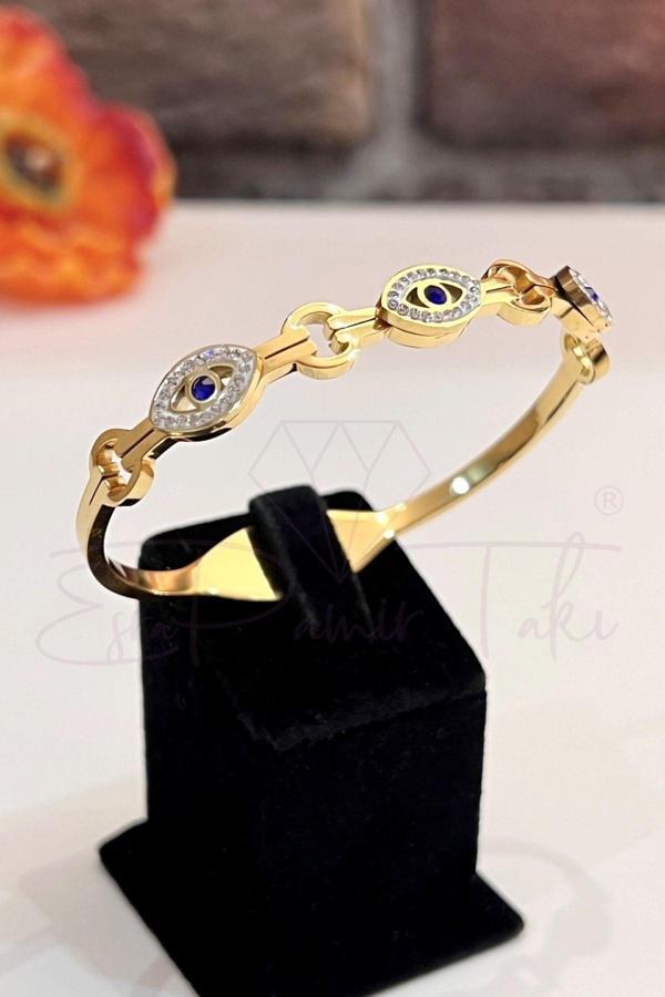 Altın Renk Nazar Boncuk Ve Göz Figürlü Zirkon Taş Işlemeli Çelik Kelepçe Bileklik - Image 1